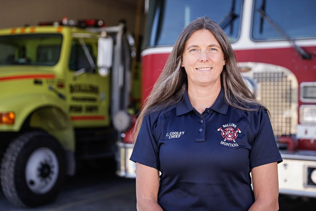 Fire Chief Carey Cooley in front of Rollins apparatus