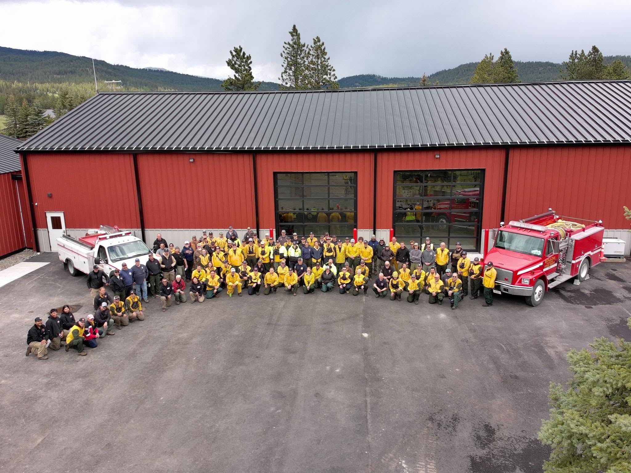 An aerial view of the Rollins fire hall with crews and apparatus