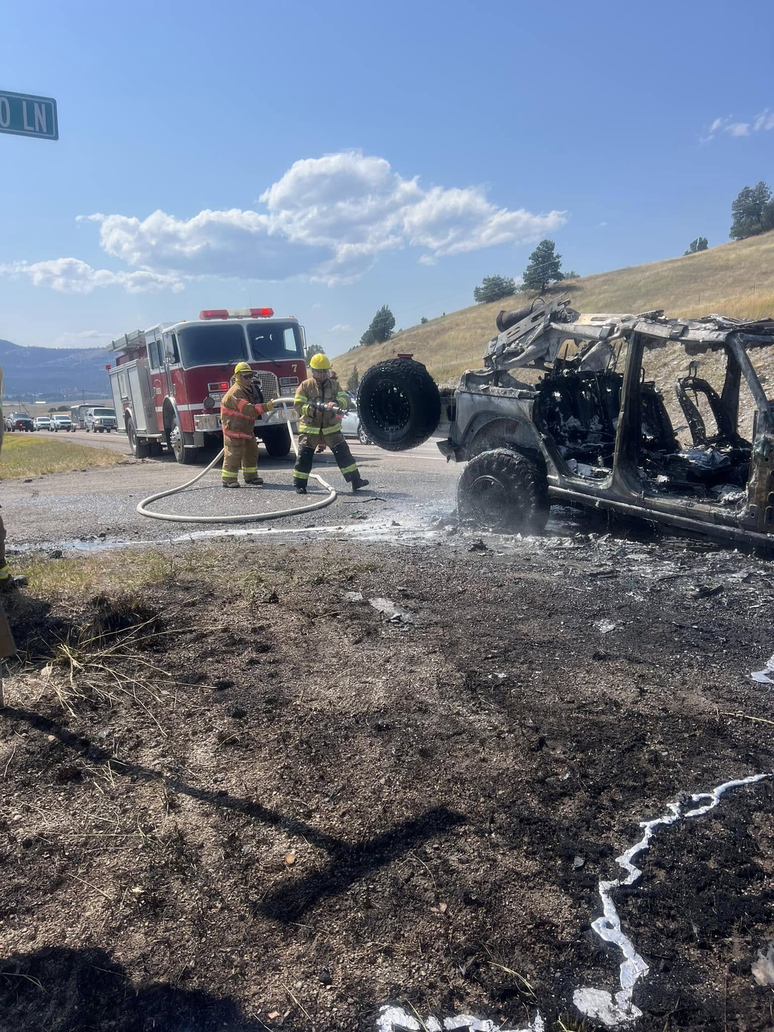 Rollins crews at a burned vehicle